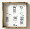 Framed cocktail menu with black and white illustrations on a white wall
