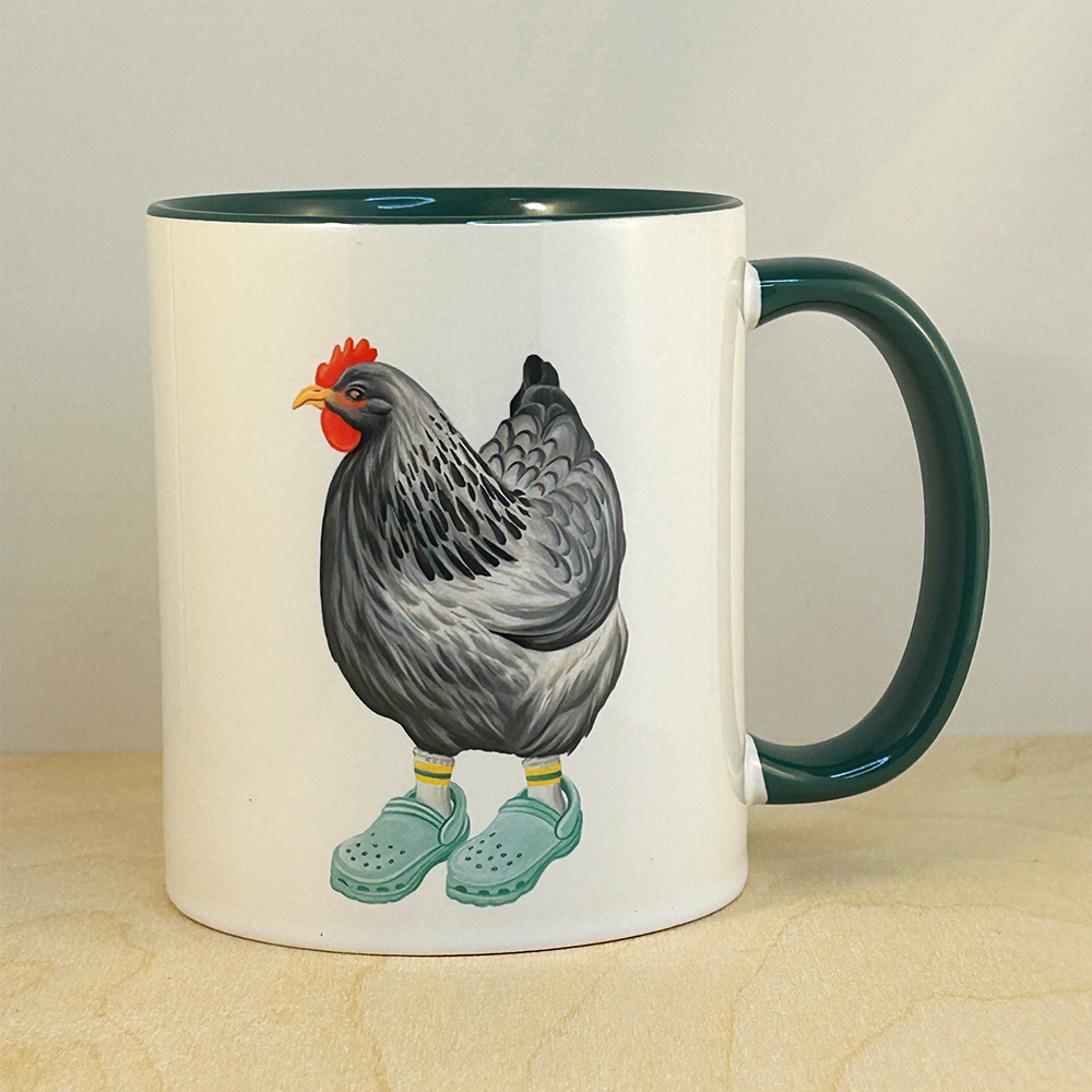 Mug with a chicken wearing Crocs design on a beige surface.