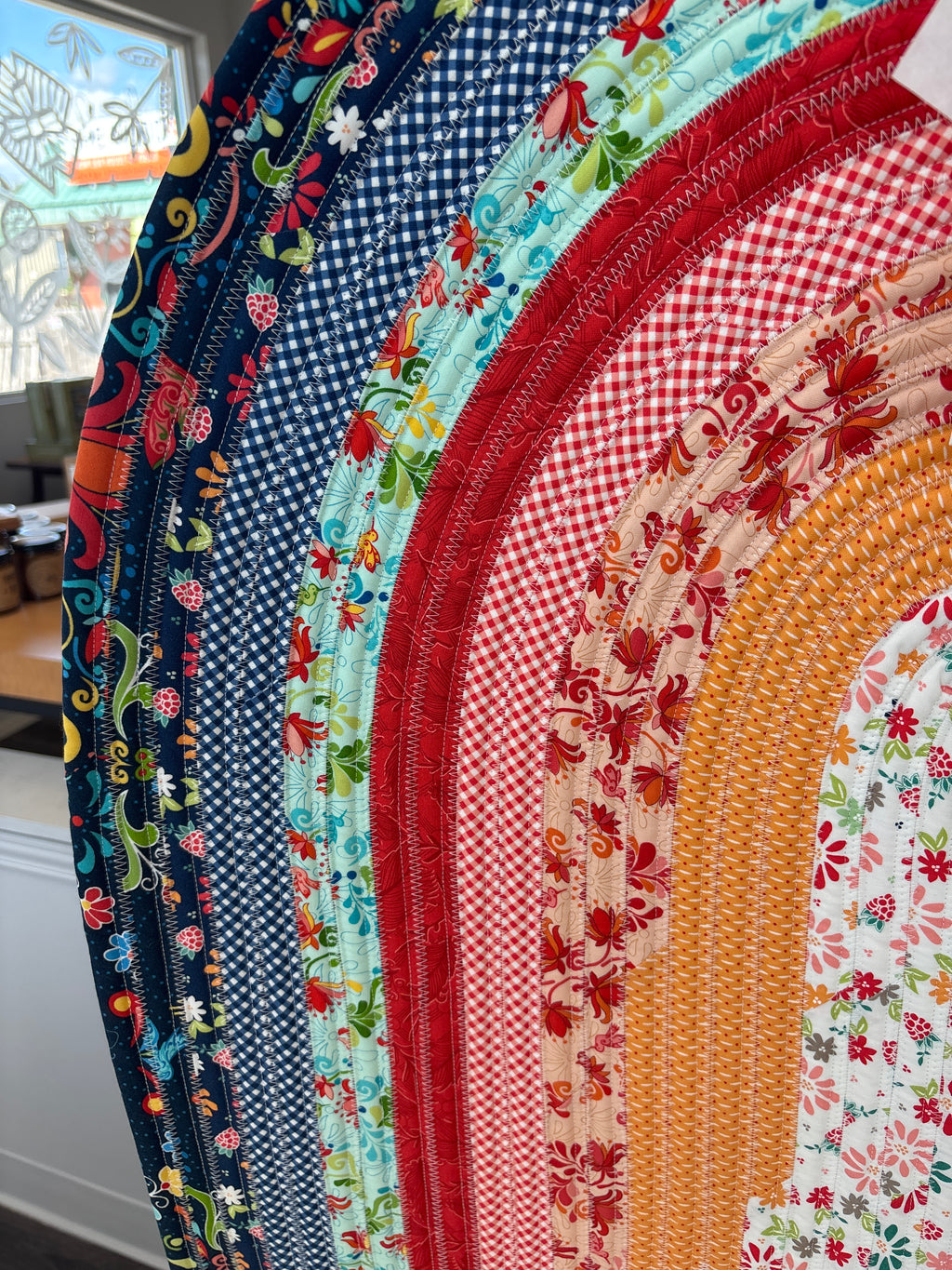 Stack of colorful fabric circles with various patterns