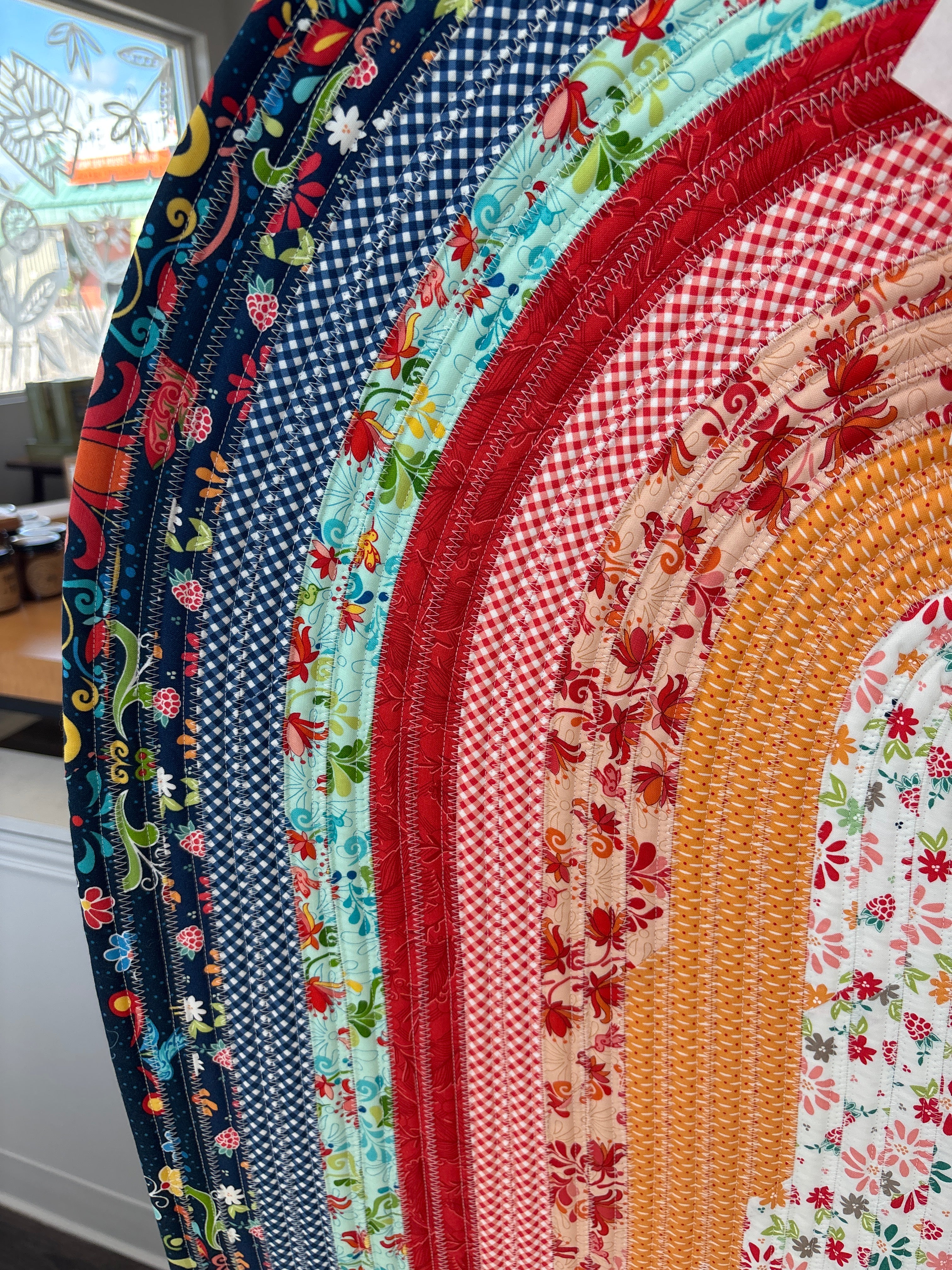 Stack of colorful fabric circles with various patterns