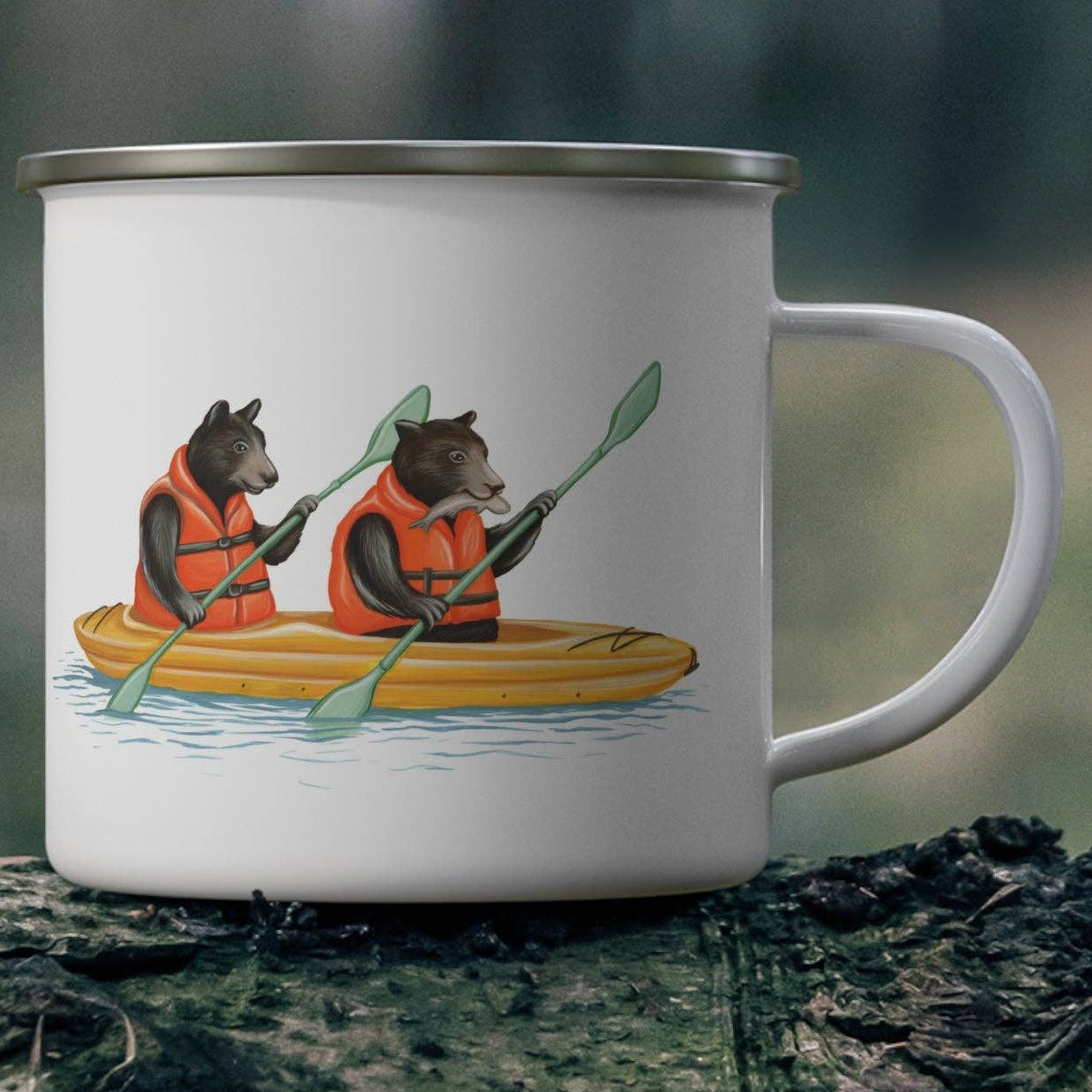 Mug with bear illustration in a kayak on a forest background