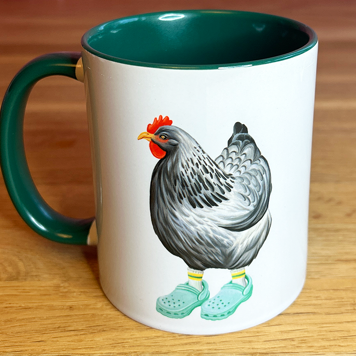 Mug with a chicken wearing crocs on a wooden surface