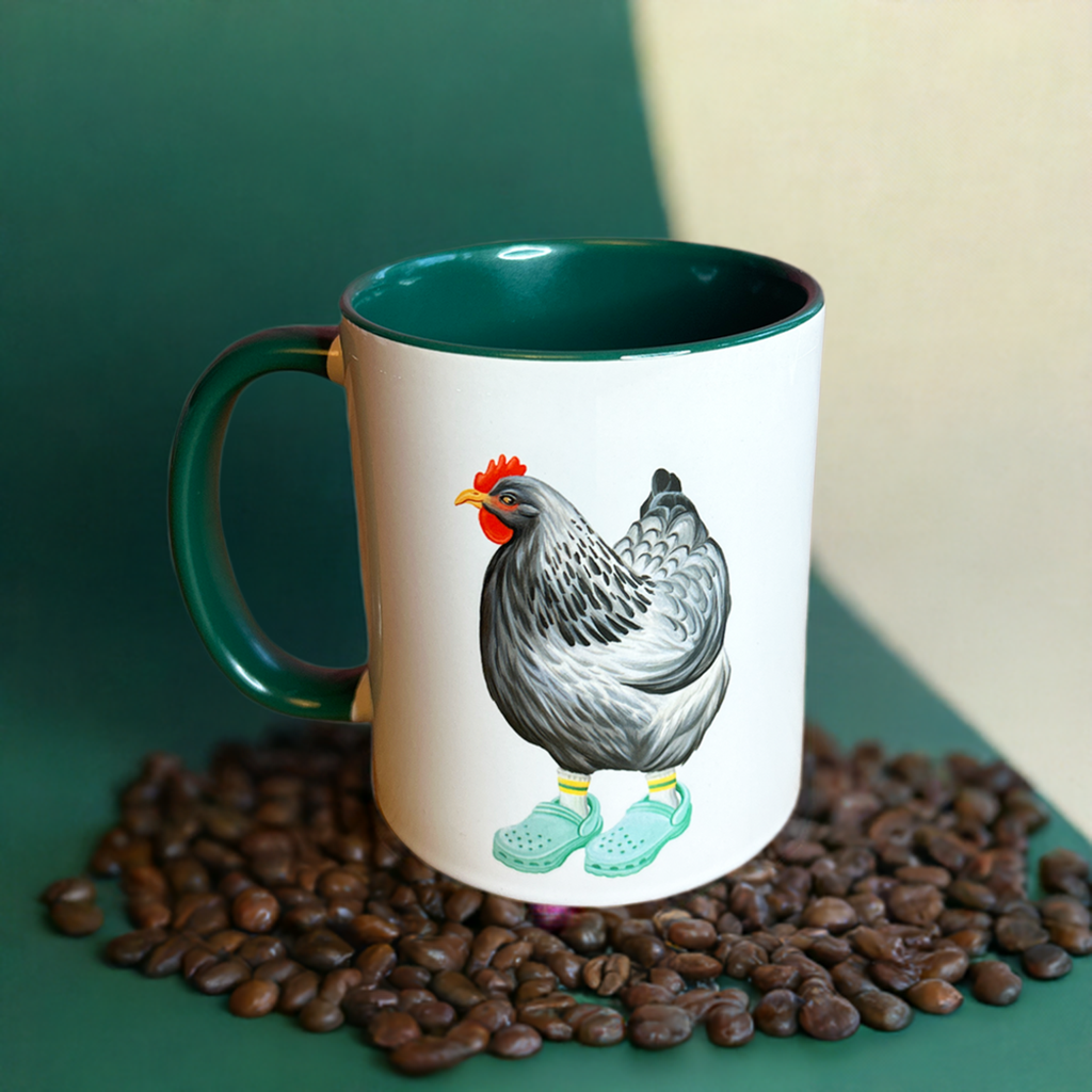 Mug with a rooster design on a bed of coffee beans