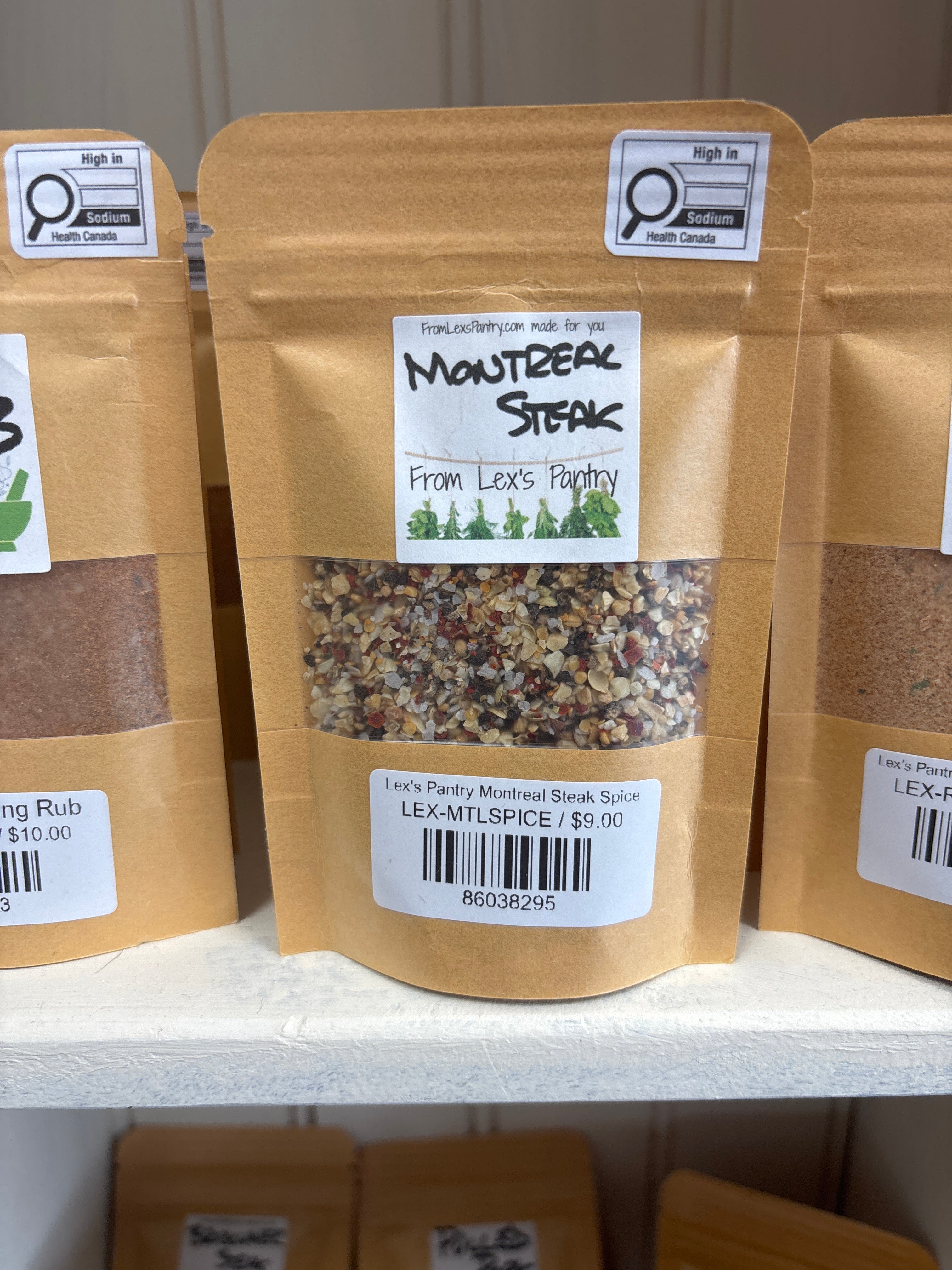 Packaged spice mix with labels on a cardboard surface