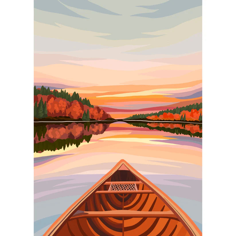 Canoe on a lake with autumn trees and sunset sky