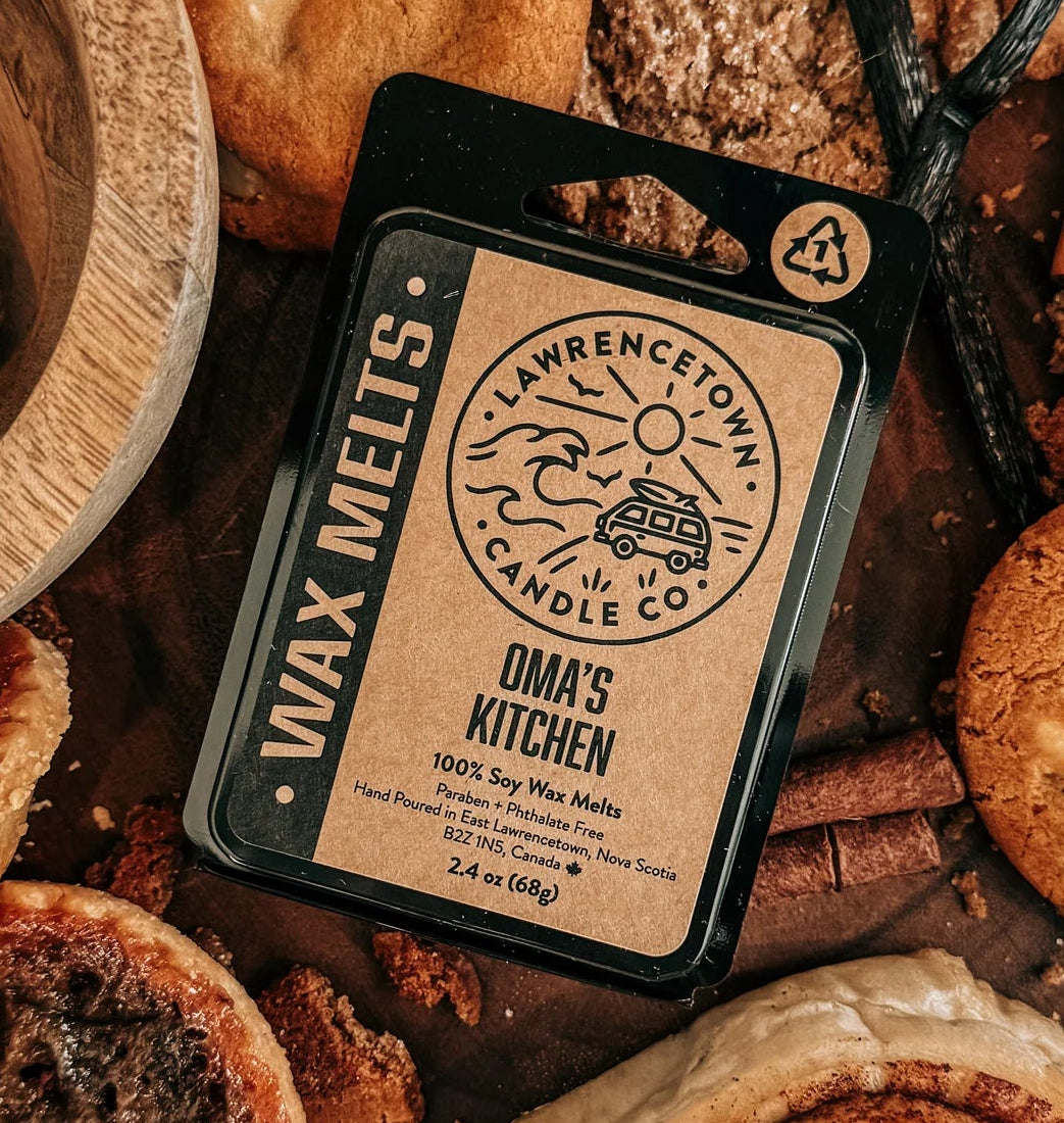 Wax melts packaging on a wooden board with cookies and spices