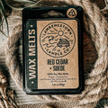 Wax melt packaging with branding on a rustic background
