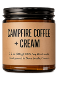 Candle jar labeled 'Campfire Coffee + Cream' on a white background