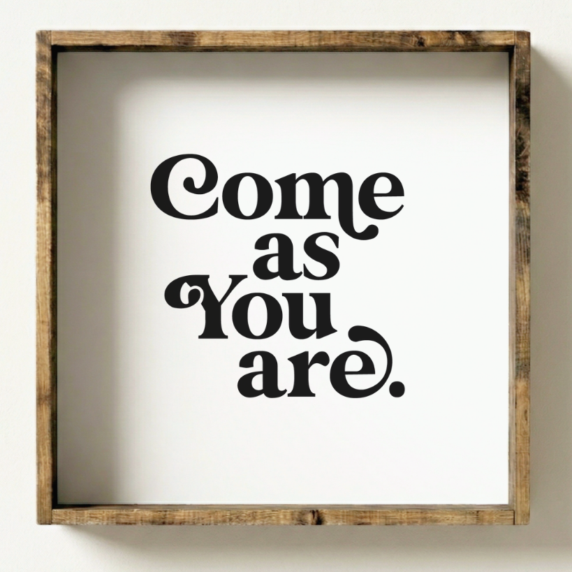 Wooden-framed sign with 'Come as You Are' text on a white background