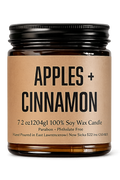Jar of 'Apples + Cinnamon' candle on a white background