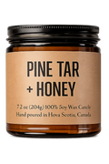 Jar of Pine Tar + Honey candle with a brown label on a white background